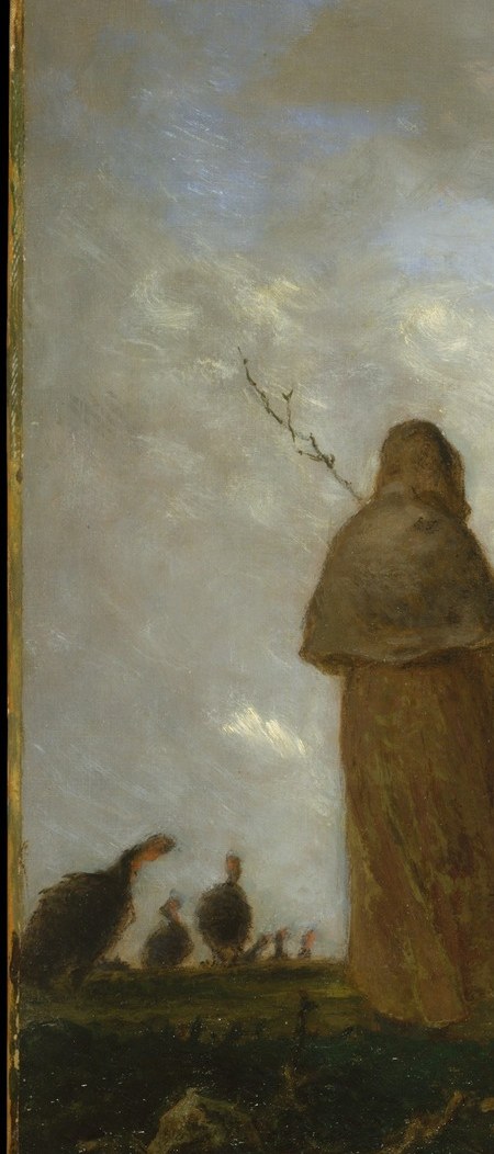 A solitary shepherd stands wrapped against the cold.