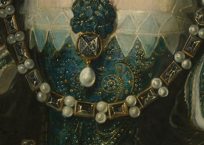 Her magnificent necklace signifies her royal status.