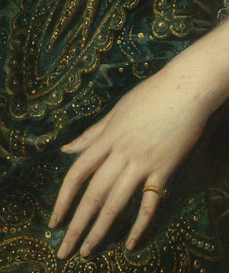 Look closely at her right hand.