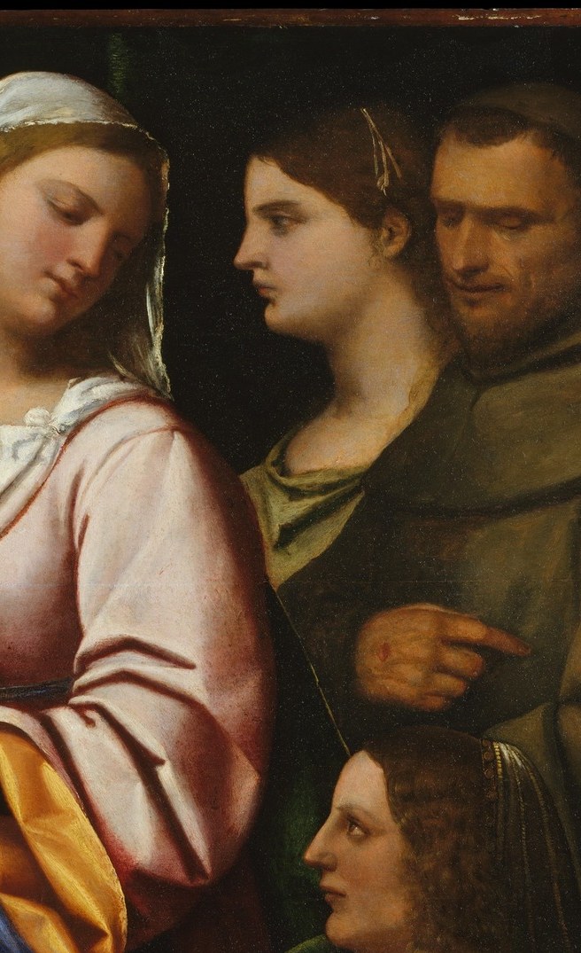 Rich amber-and-cream robe deliberately contrasts the Madonna's blue; any attribute she carries (wheel, palm, lily) identifies her and illuminates the patron's devotional network
