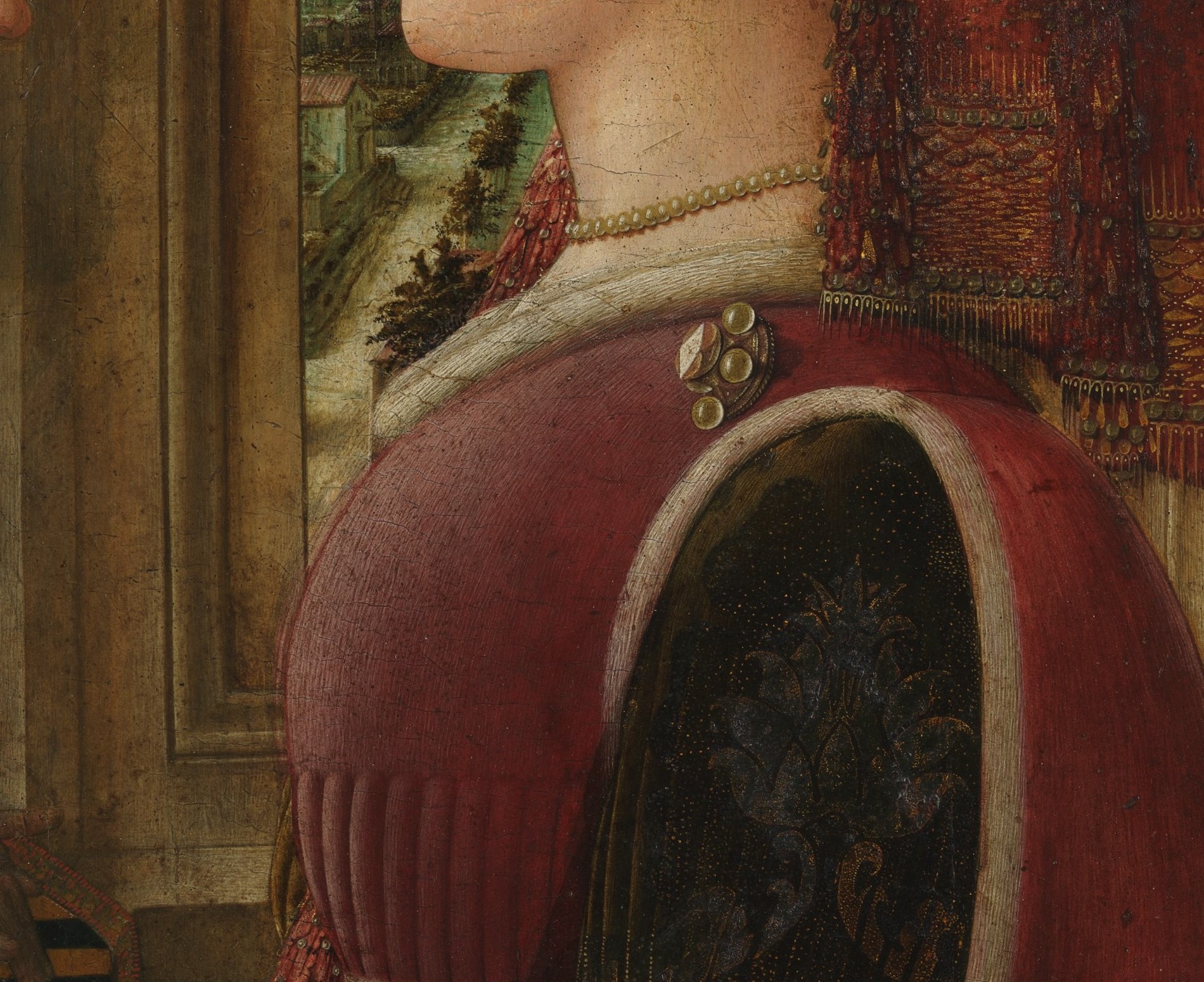 The deep lacquer-red saturates nearly a third of the canvas; its smooth gradients show Lippi's command of tempera glazing on panel and anchor the color hierarchy of the composition.
