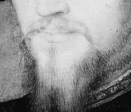 The neatly trimmed beard and mustache add to the sitter's dignified appearance.