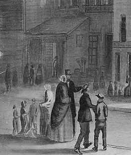 Small figures move through the cold. The street dwarfs them.