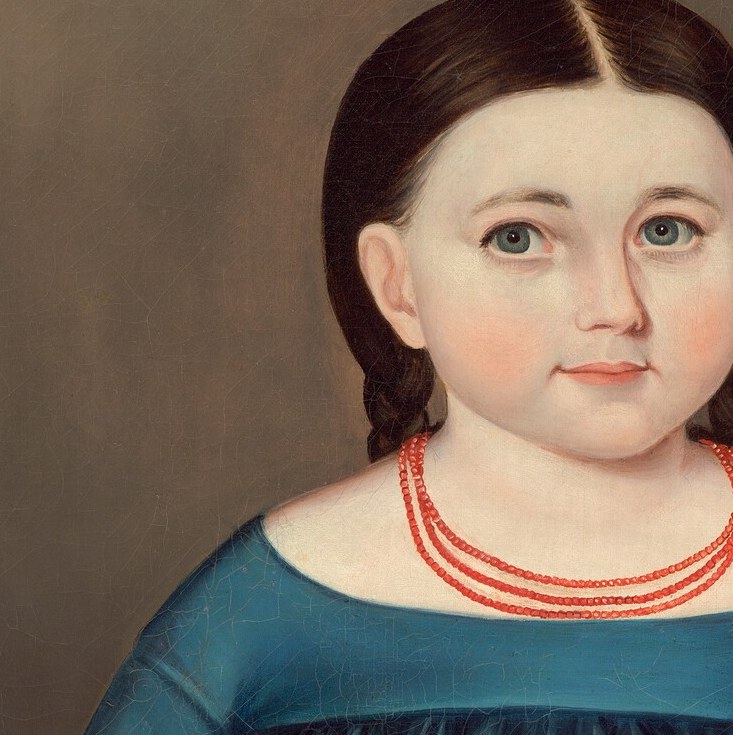 Her direct gaze and slightly parted lips convey a sense of innocence and perhaps a hint of apprehension.