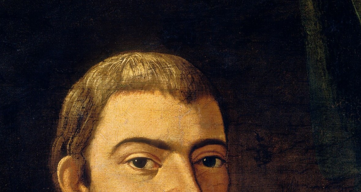He looks at you. Not past you. That's the whole painting.