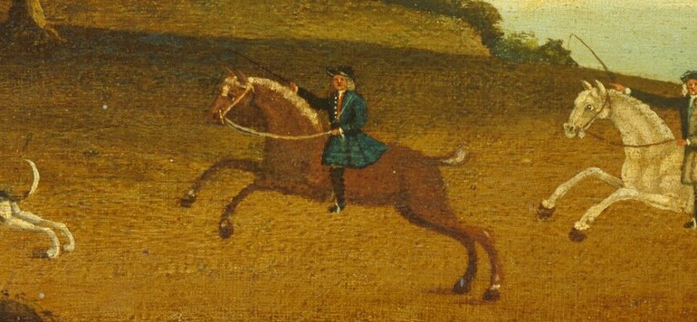 Riders urge their horses forward.