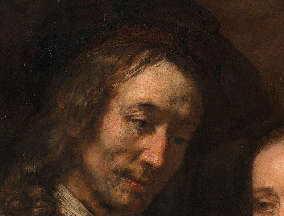 His gaze is directed downwards, suggesting tenderness or contemplation towards the woman.