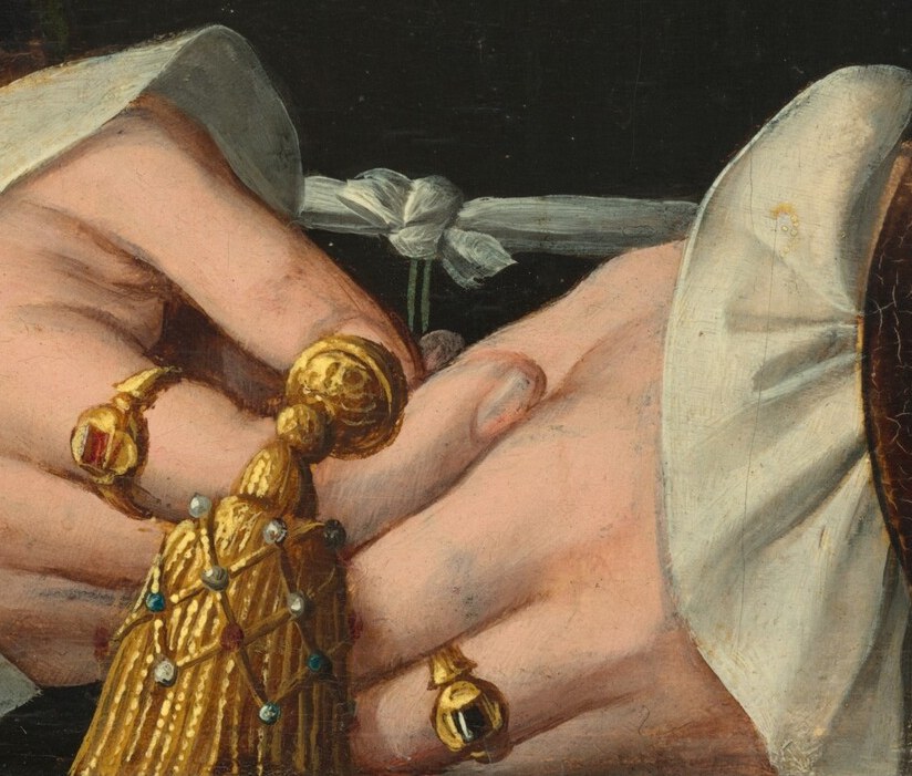 And the gold tassel ornament she holds signals her wealth.