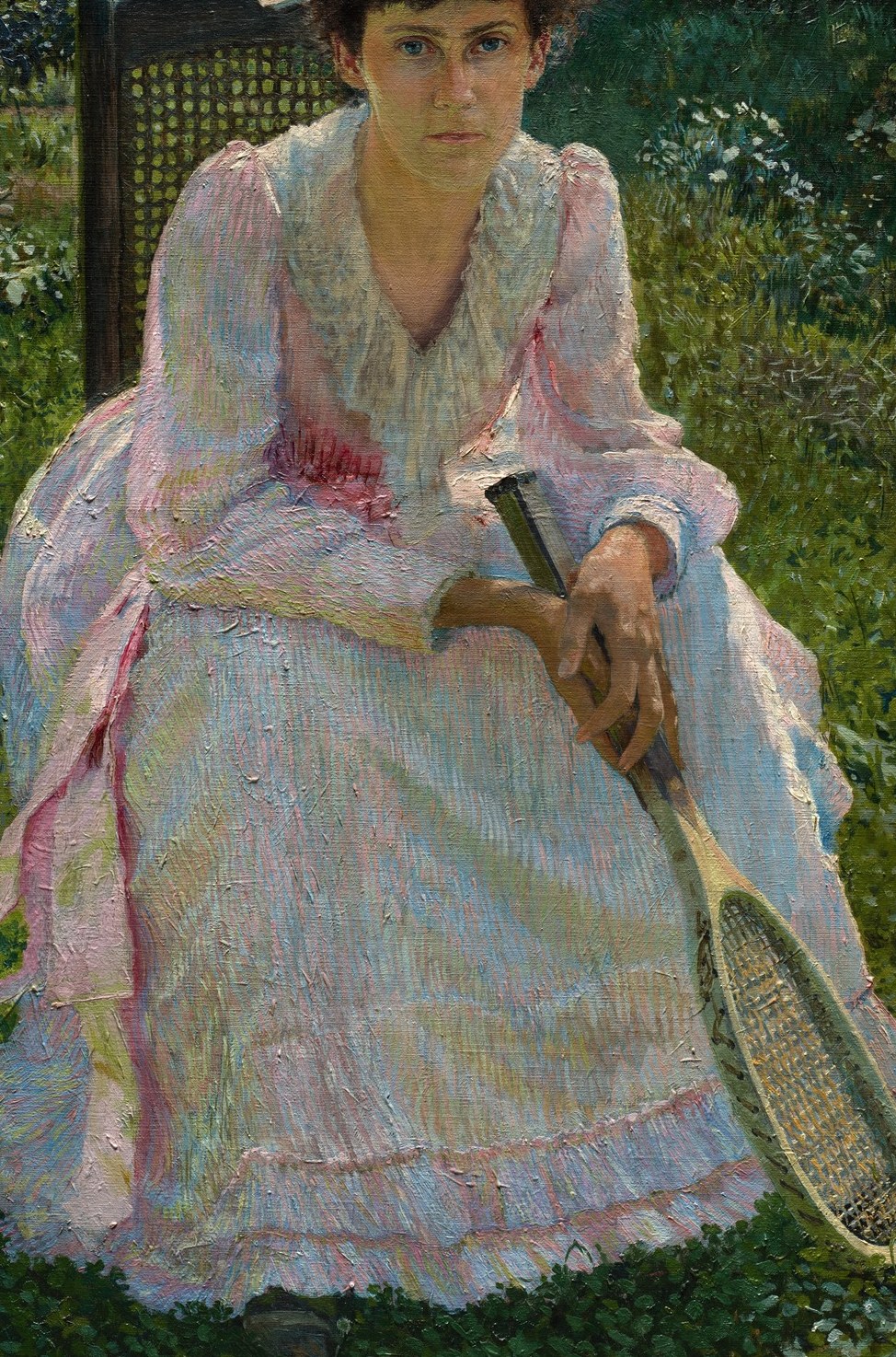 Her white and pink dress suggests the era's style.