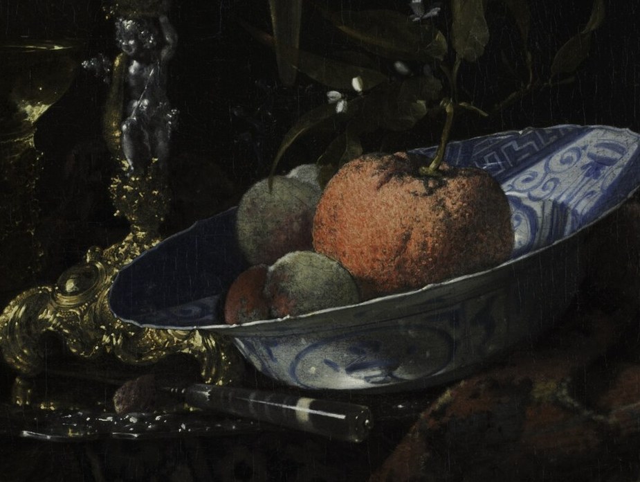 The Wan-li or Kraak-style porcelain signals VOC trade wealth; the cobalt decoration is legible and filmable as an icon of 17th-century Dutch global commerce.