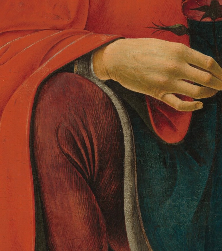 The rest hangs on the object in his left hand.