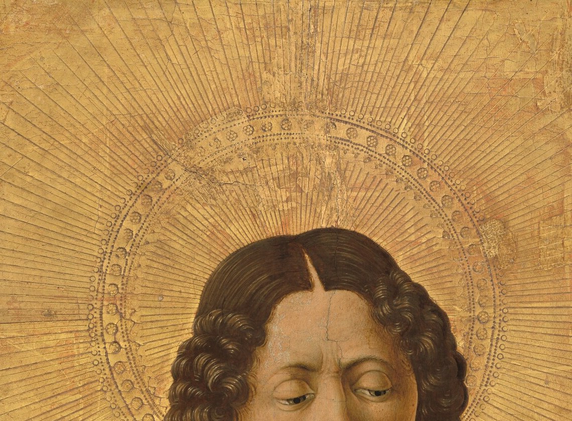His face was designed to meet a kneeling worshipper's eyes directly.