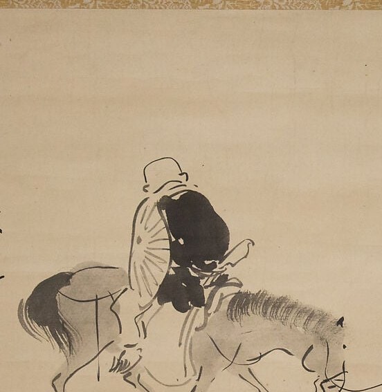 But he's riding backward.
