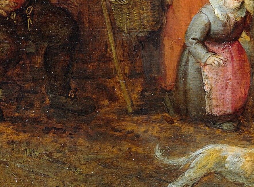 A clean white dog sits among the filth. Domestic loyalty amid chaos.