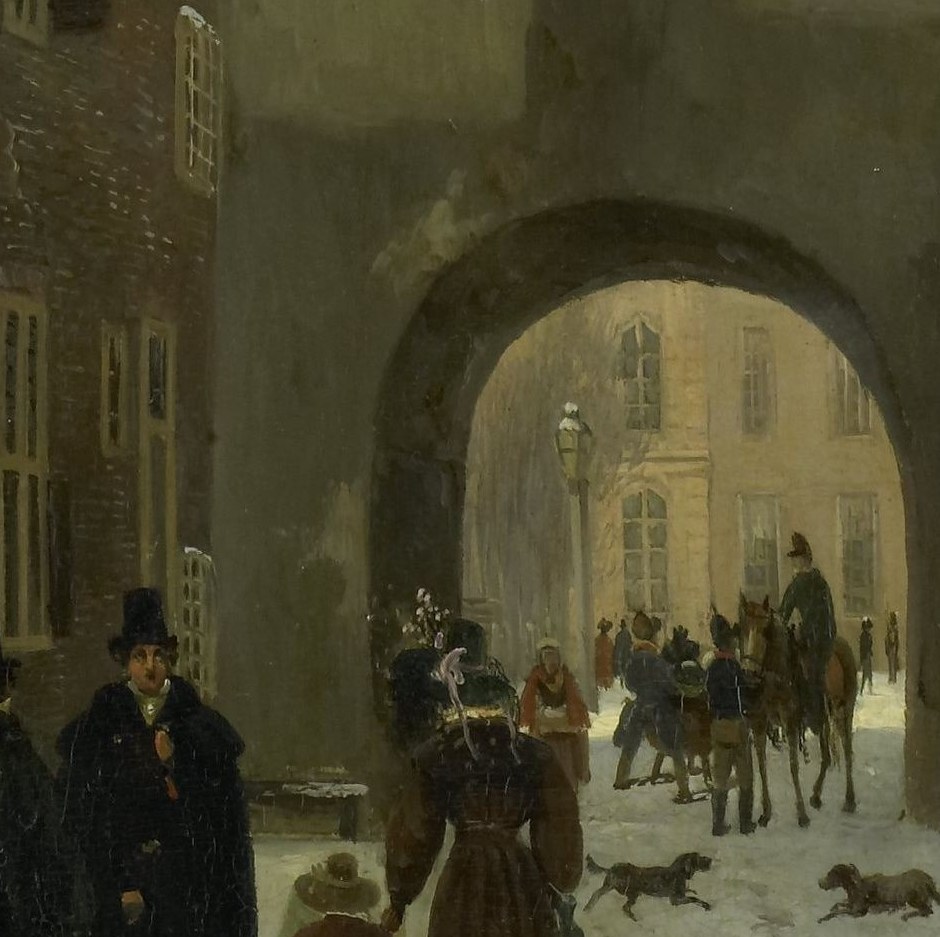 Snow blankets the historic Gevangenpoort archway.