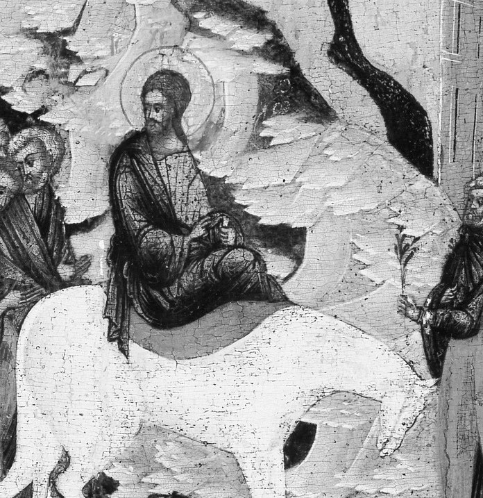 He rides on a white horse.