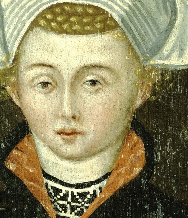 Her pale complexion and direct gaze create a sense of quiet presence.