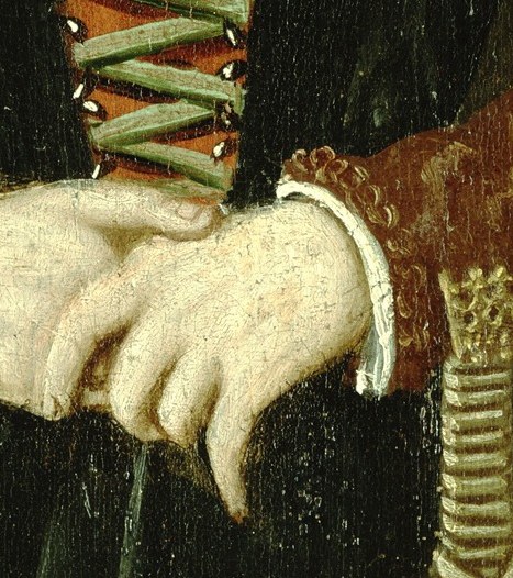 Her hands are clasped, holding a woven basket for domestic use.