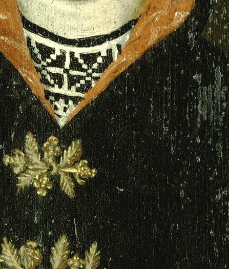Her gold embroidery and red sleeves suggest status in her community.