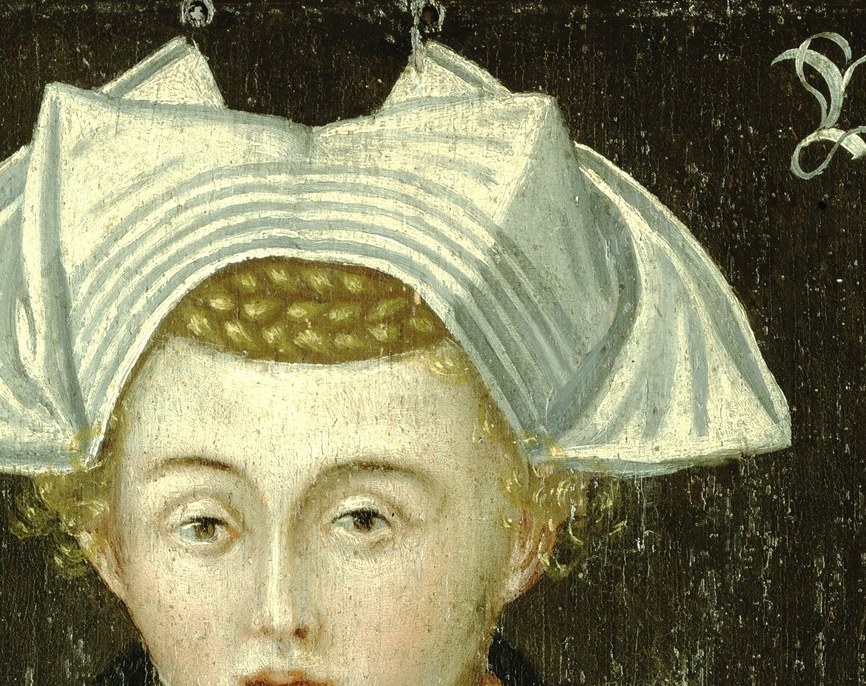 Her intricate headdress and collar show fine craftsmanship.