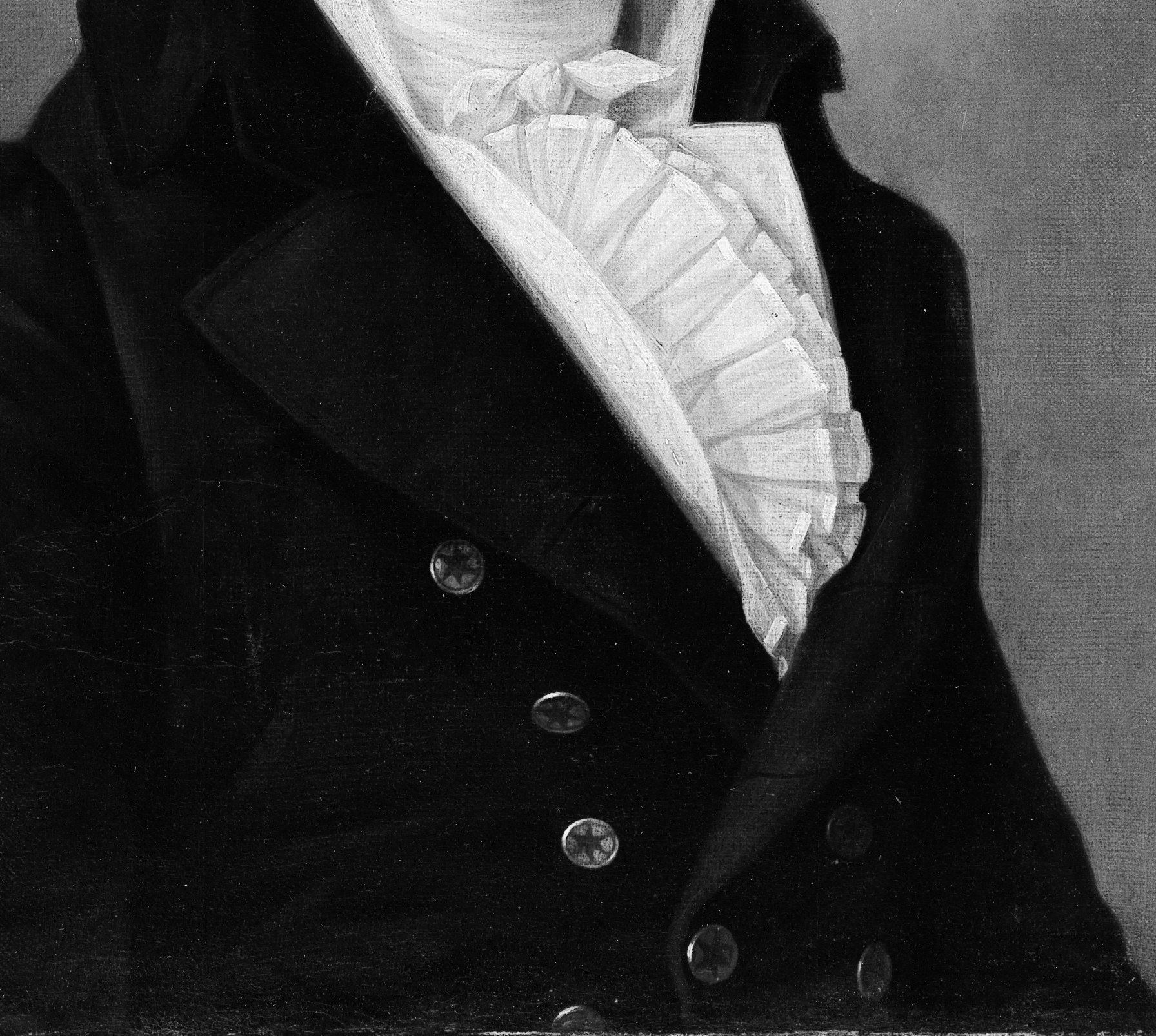 His dark blue coat suggests a formal occasion.