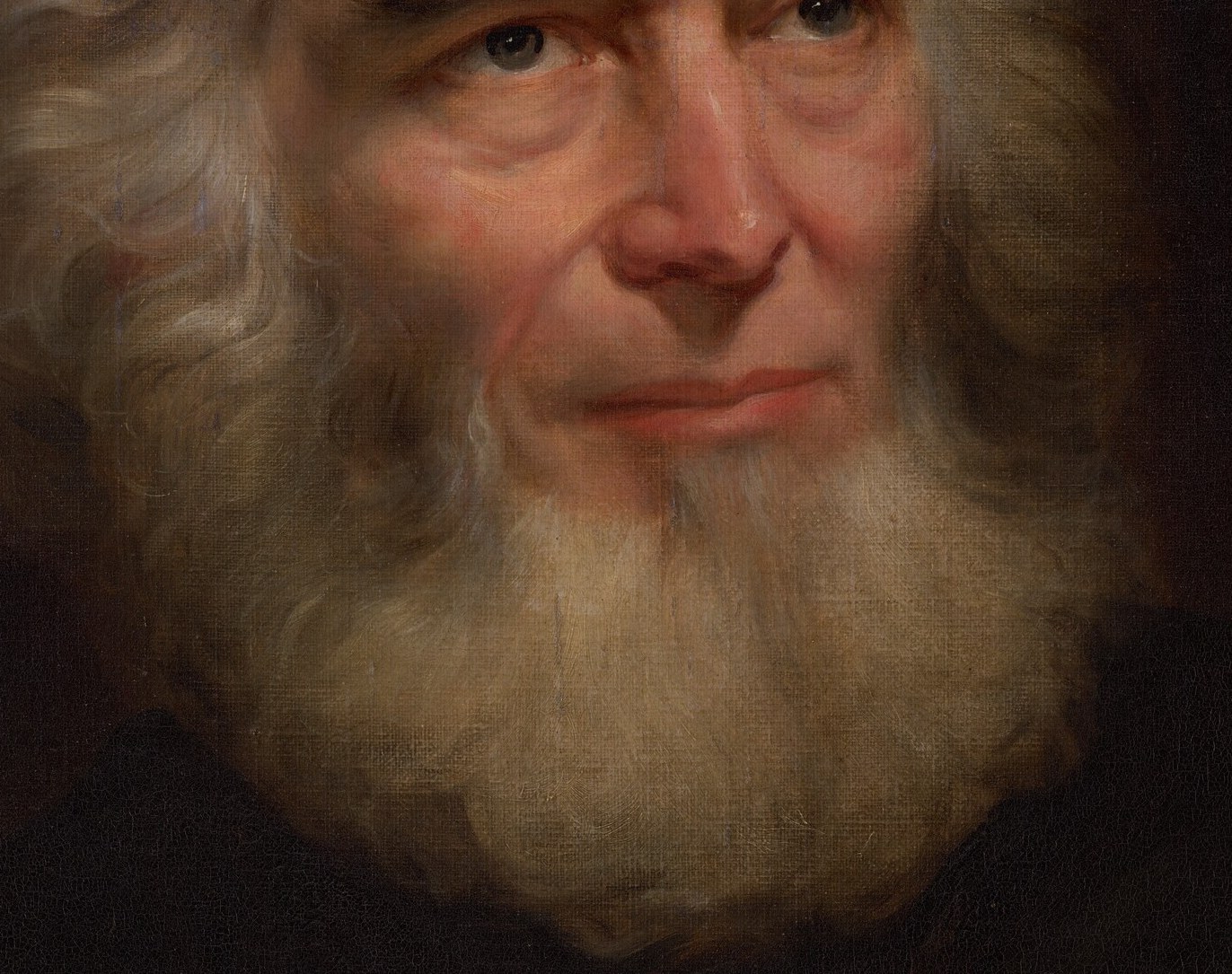 Look closely at his white hair and beard.