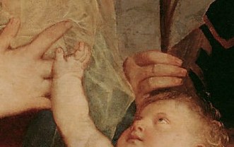 His mother's hands cradle him gently.