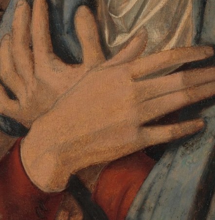 Her hands gently protect the child.