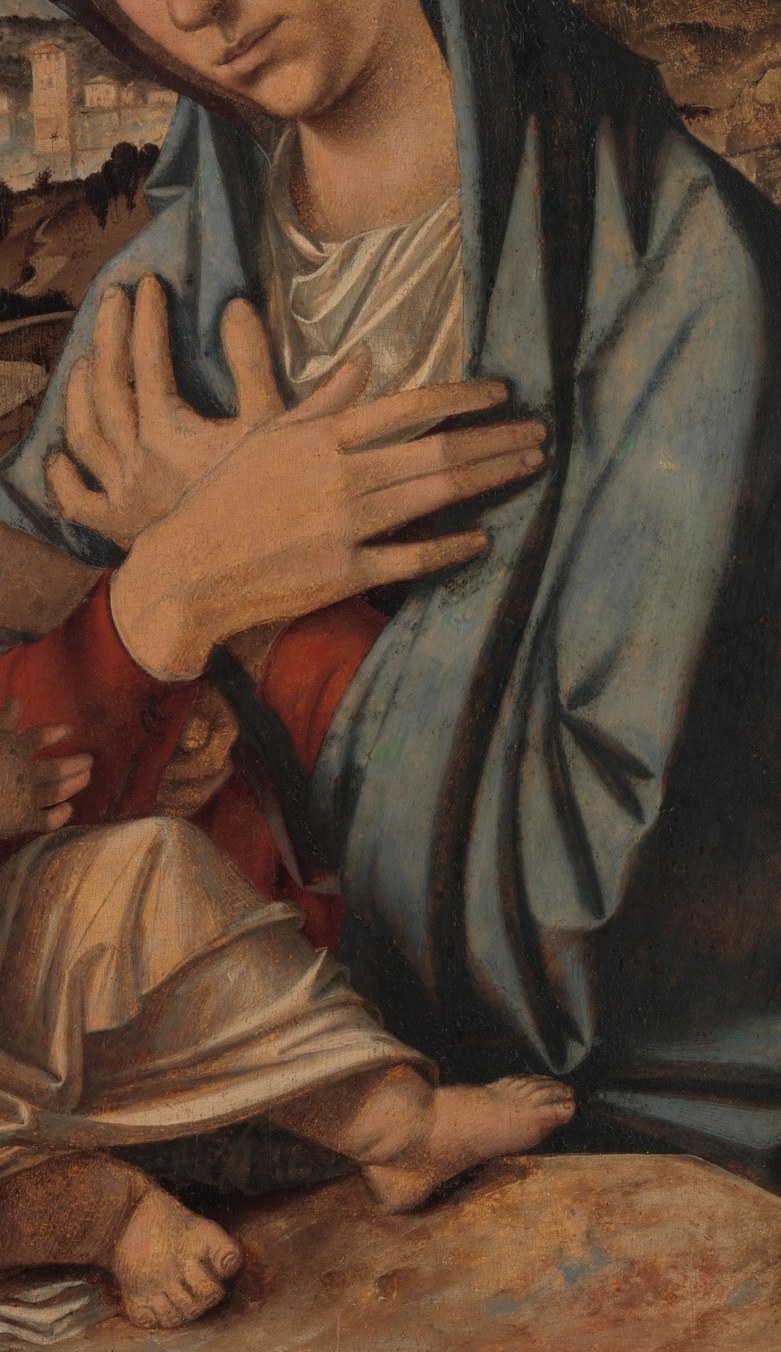 The rich blue fabric and soft folds suggest a sense of divinity and regality.