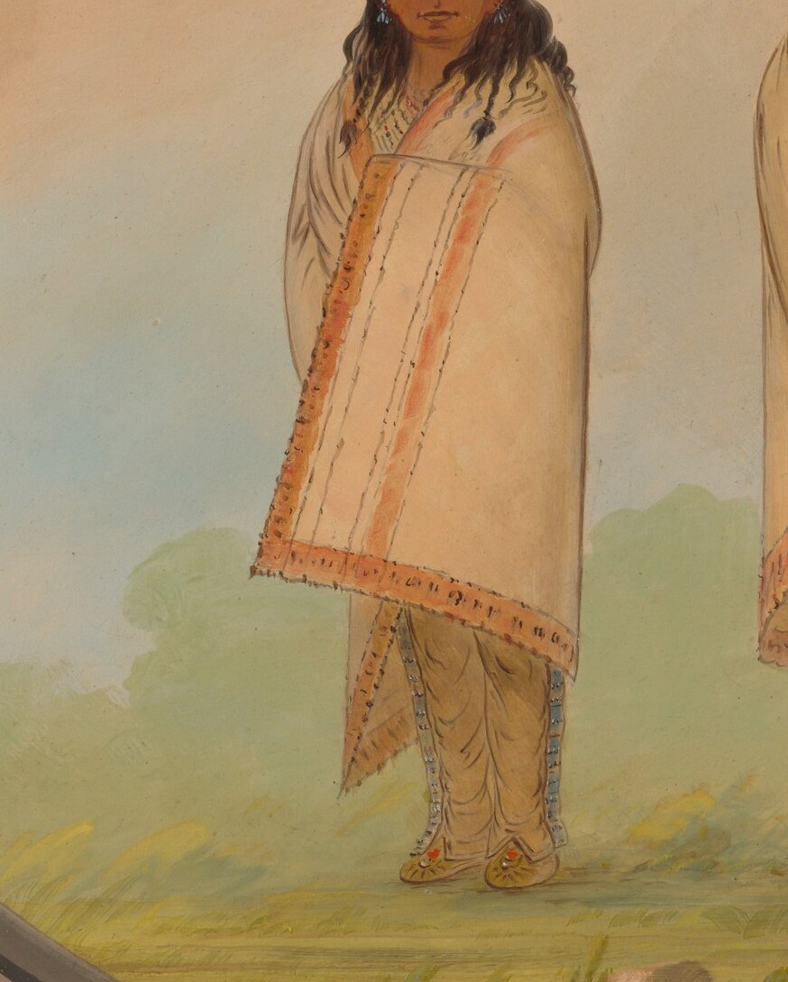 His sister's robe displays intricate, traditional craftsmanship.