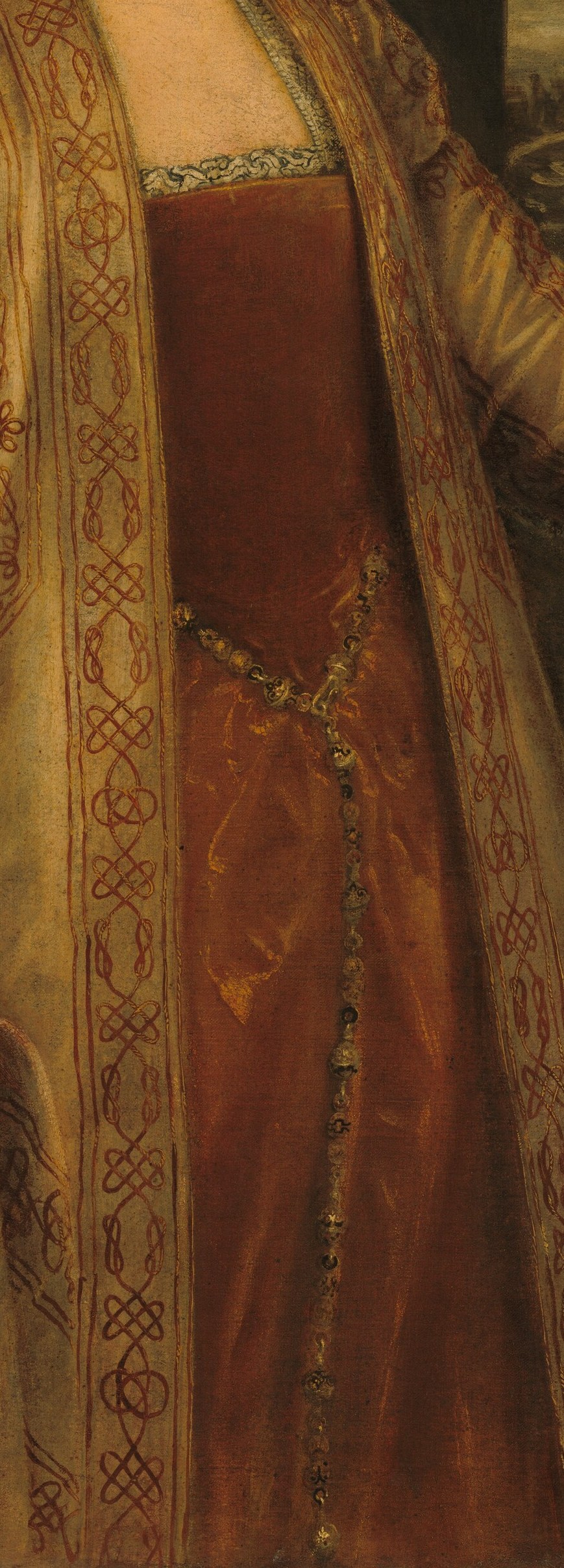 Her elaborate red dress and pearls speak of wealth.
