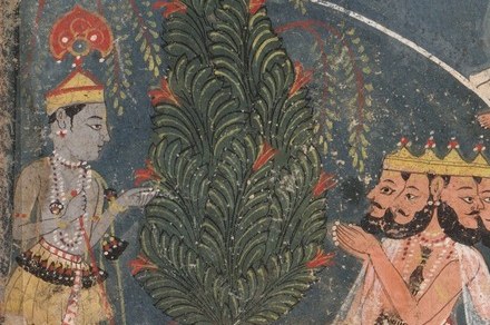 He is surrounded by devotees, lost in his music.