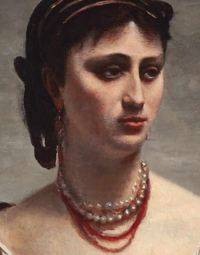 Her gaze is averted, perhaps a quiet introspection.