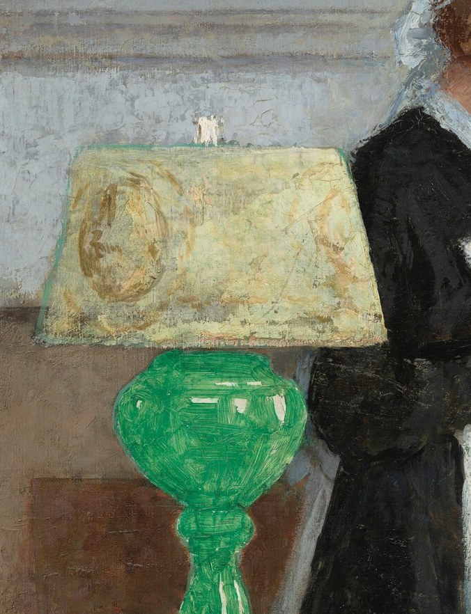 The lamp glows with a deep green.