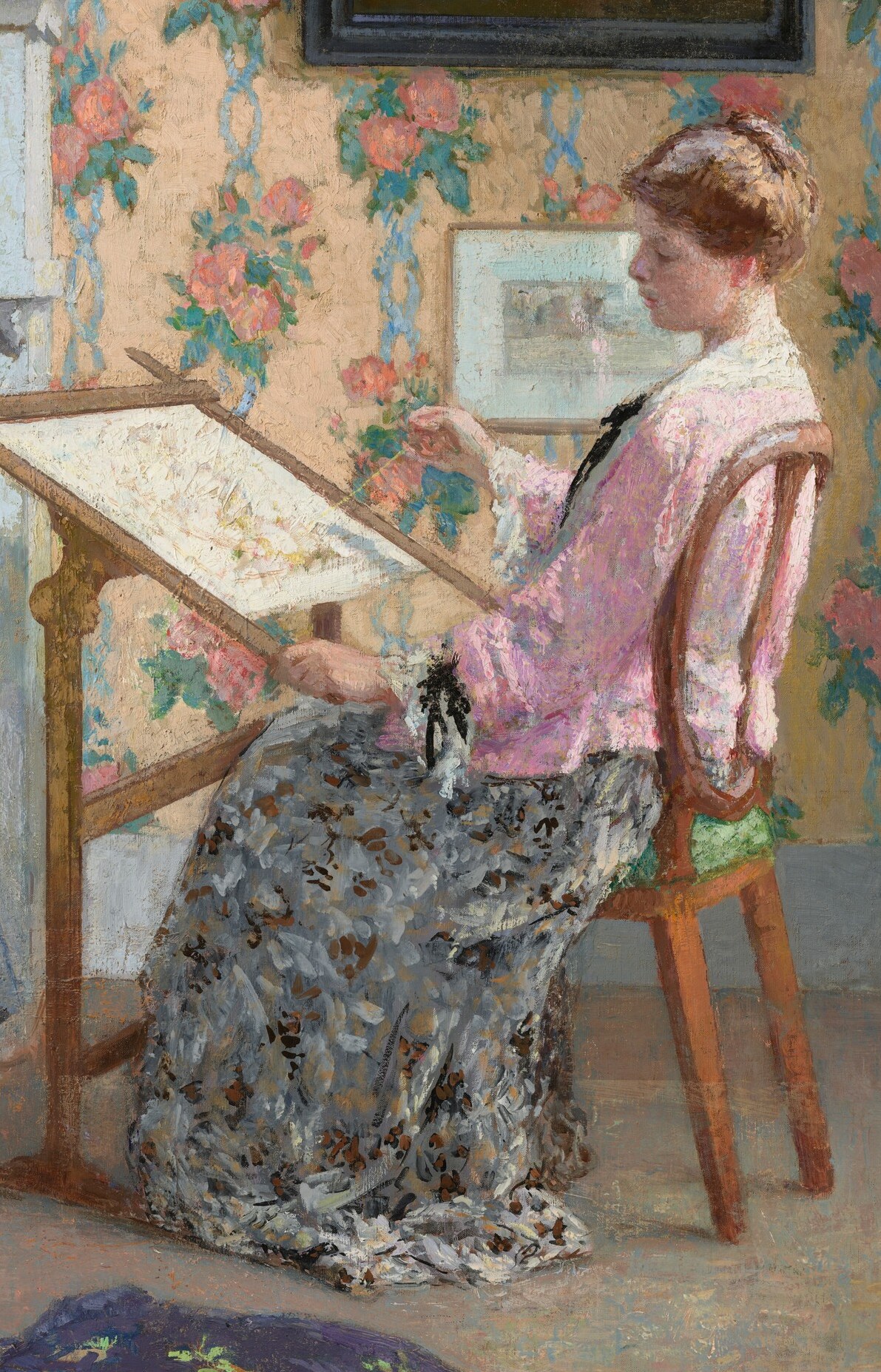 She focuses on her embroidery.