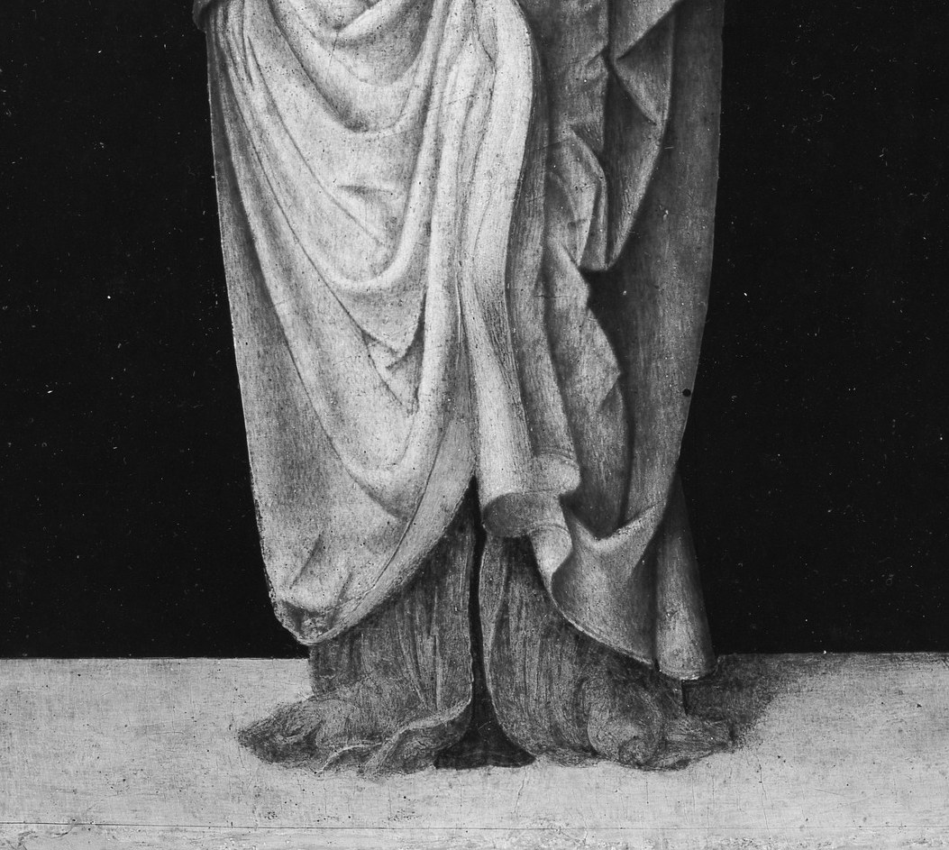 The sculptural folds in the lower garment are the painter's most virtuosic passage, deep shadows and crisp ridges that reward close examination of his handling of light on fabric.
