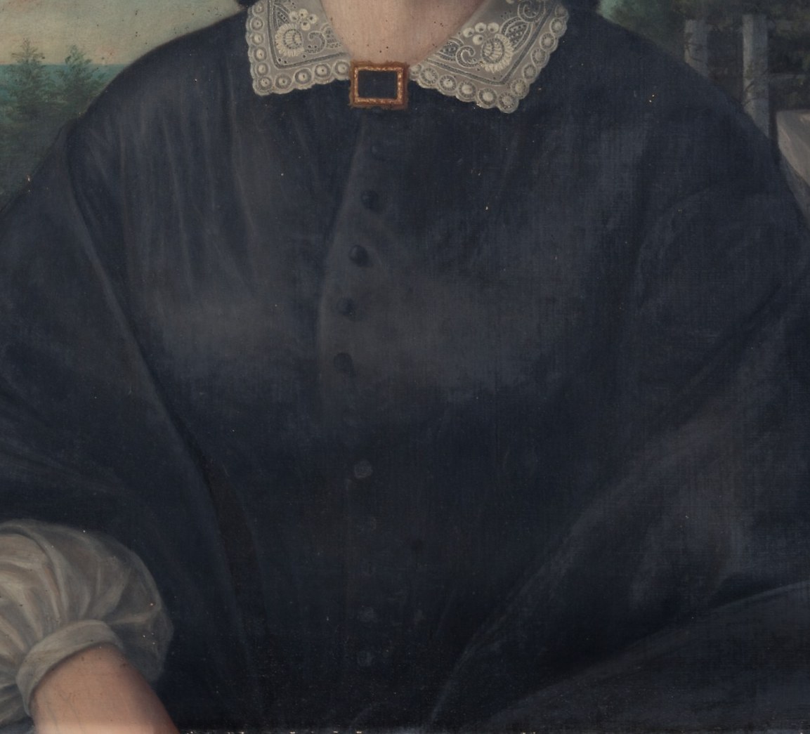 Her dark dress and simple brooch speak to her modesty.
