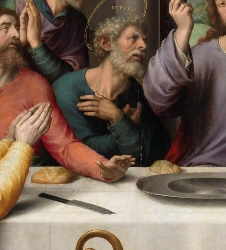 Lean in close, left of center. Judas has no halo.