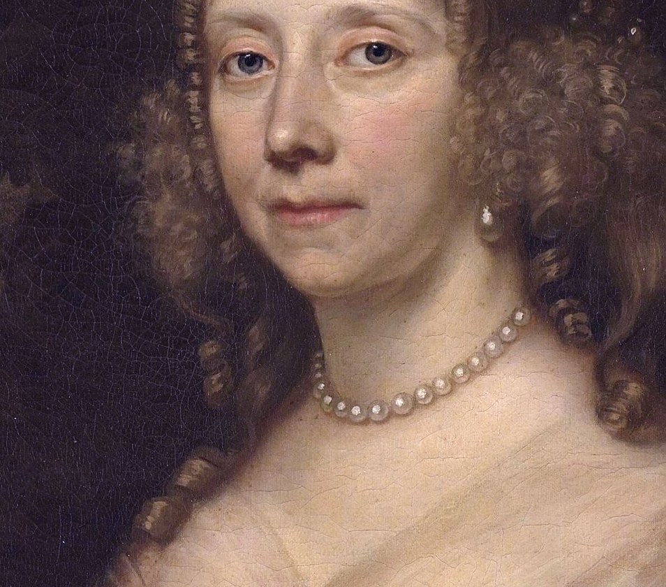 Her direct gaze and subtle expression convey a sense of quiet dignity and perhaps a hint of melancholy.