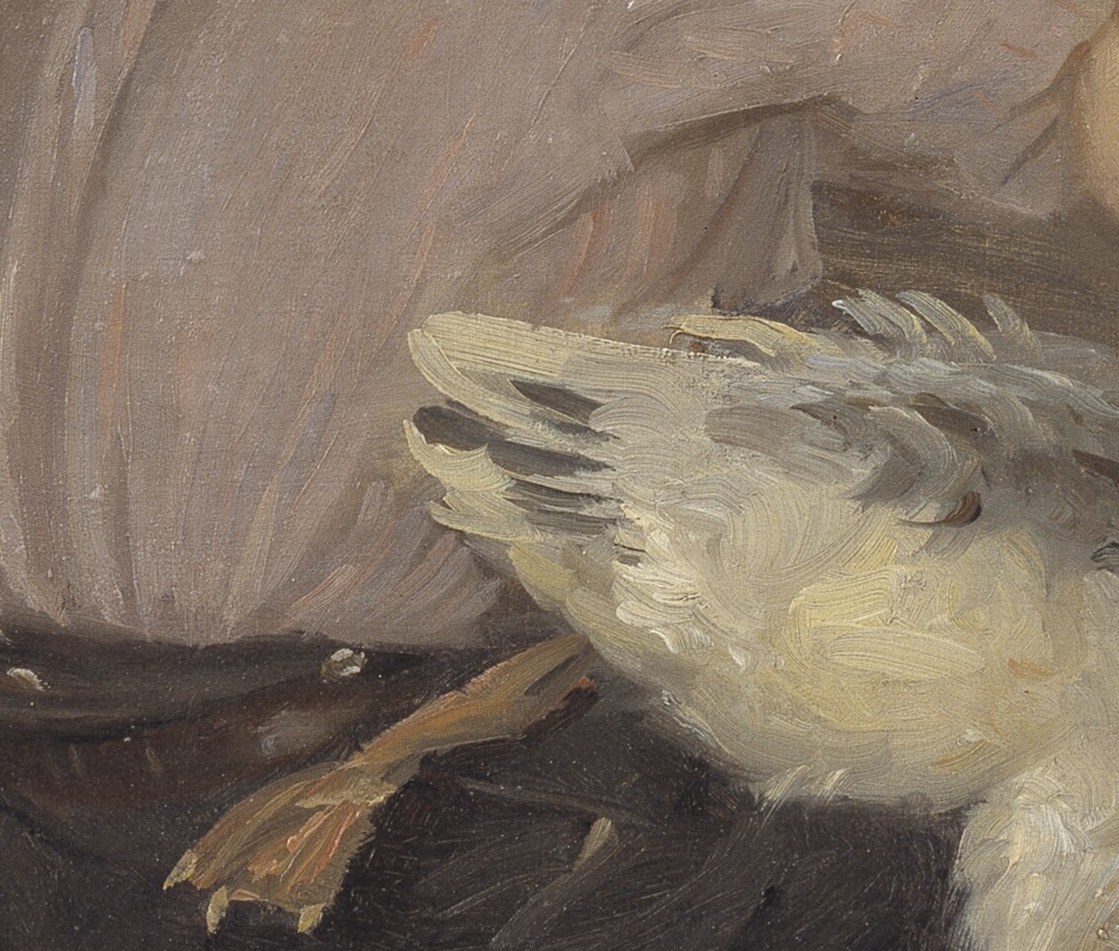 His hands are mid-task, gripping the bird without pause.