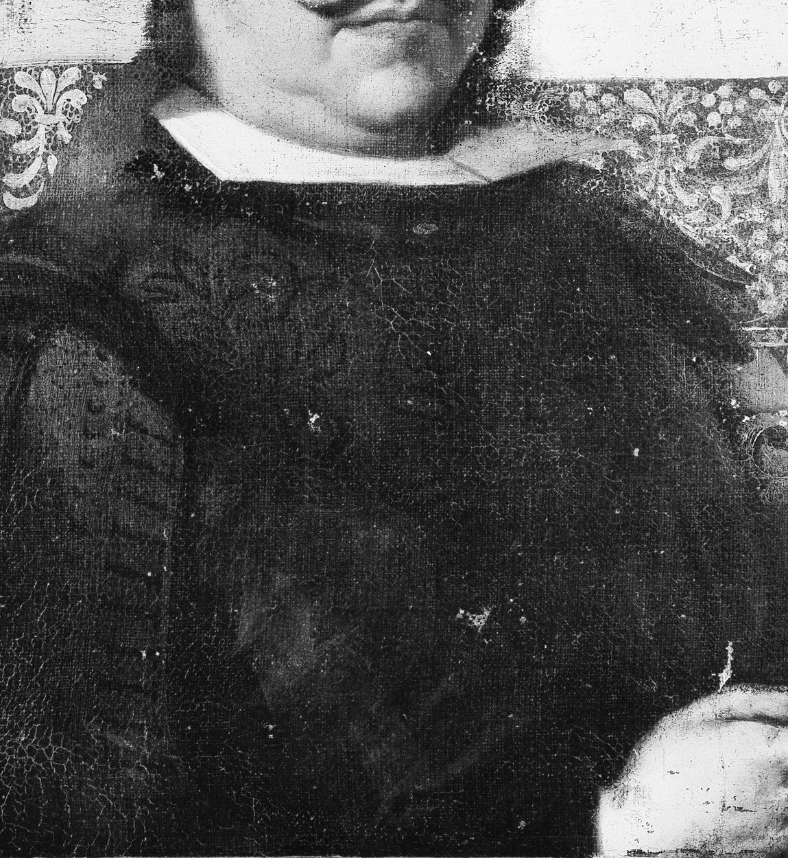 His dark robe and collar show his status.