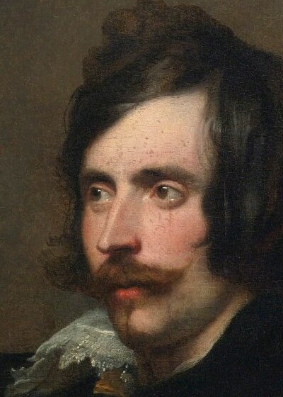 His gaze suggests introspection or focus elsewhere.