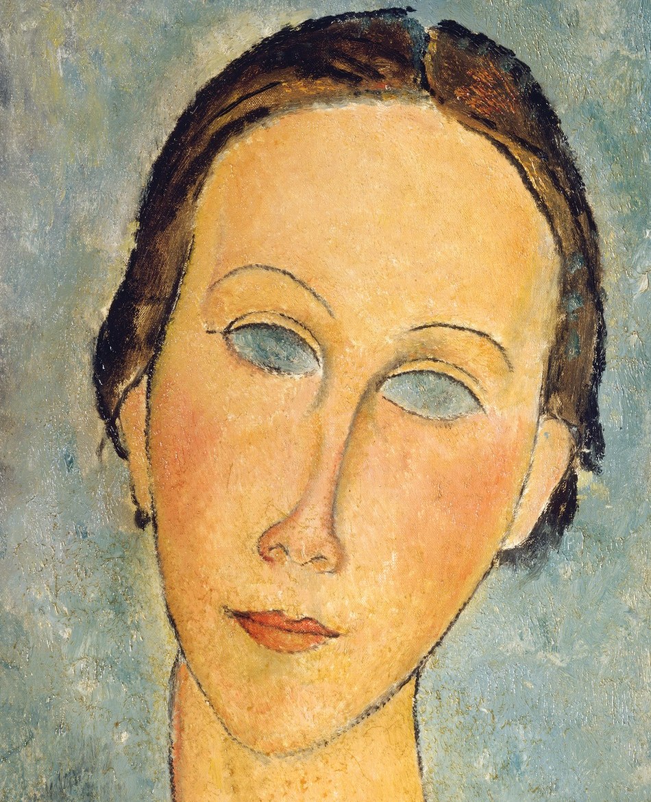 Her face is long and mask-like.