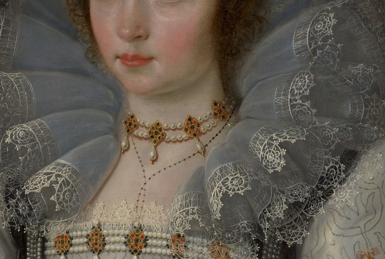 Her elaborate lace collar shows her status.