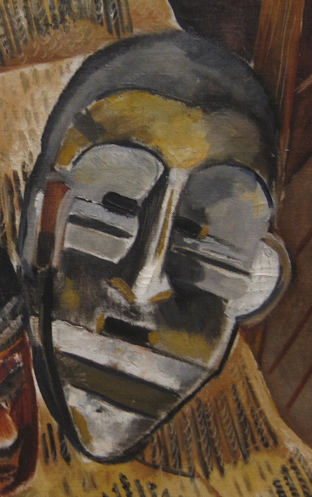 These masks evoke ceremonial objects from West Africa.