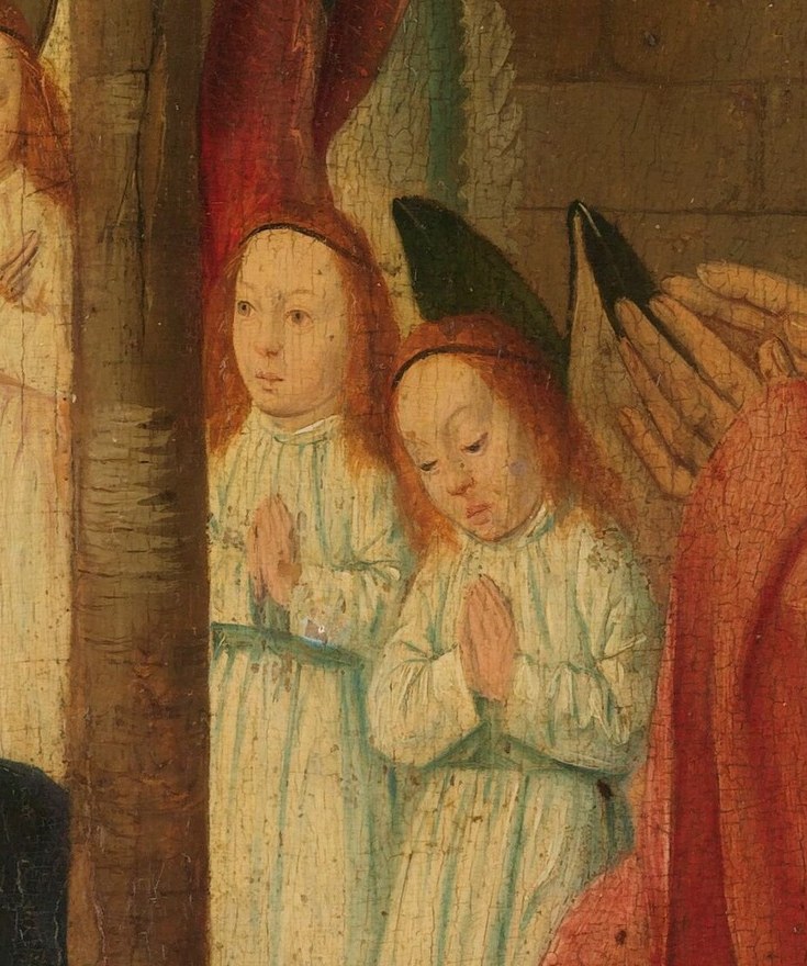 Three angels lean forward, awestruck by the tiny child.