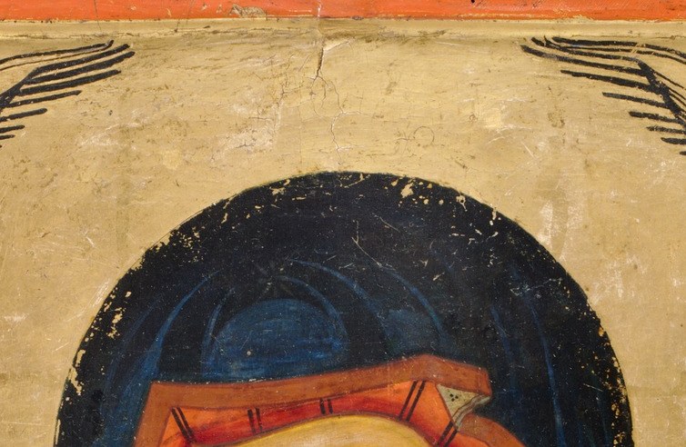 Her dark veil frames a face built for devotion, not portraiture.