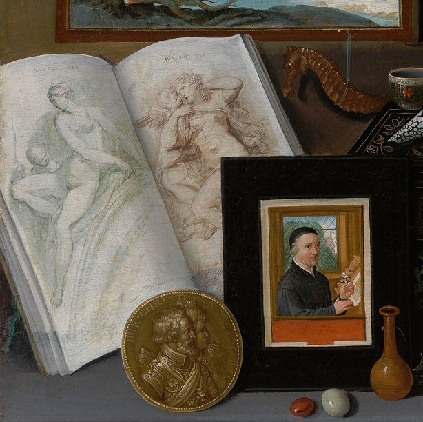 An open book with anatomical drawings reveals intellectual pursuits.