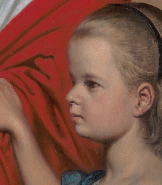 Her profile view and focused expression draw the viewer into her world, suggesting a moment of quiet observation.