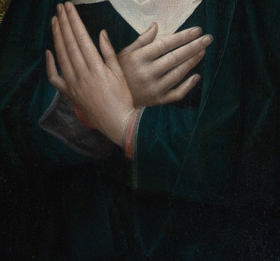 Hands pressed flat together rather than wringing , supplication and acceptance at once; the gesture mirrors the theological claim that Mary consented to her son's sacrifice.